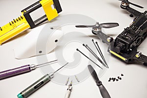 Repair maintenance drone, screws, screwdrivers, battery clamps
