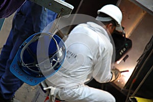 A Repair Man Busy Welding