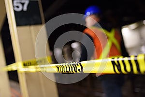 Repair in New York subway. MTA worker on the platform of the NYC subway station behind the caution tape