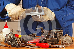 Repair of old parts car engine in workshop
