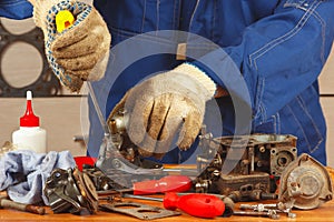 Repair of parts car engine in workshop