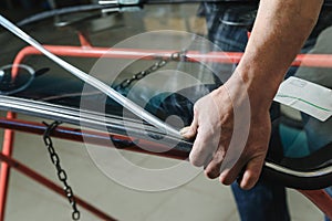 Repair and replacement of the windshield of the car.