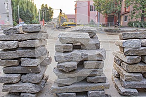 Repair of roads.the curb from the dismantled road lies on the asphalt