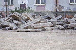 Repair of roads.the curb from the dismantled road lies on the asphalt