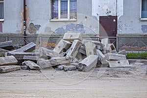 Repair of roads.the curb from the dismantled road lies on the asphalt