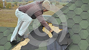 Repair of the roof of a residential building. Dismantling soft tile.