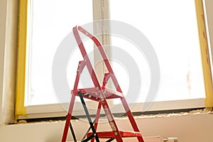 Repair in the slopes of the window. The process of applying a layer of plaster on the sides of the window.