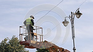 repair street lamp, crane lifted, light bulb