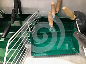 Repair tool. shelf in a hardware store with a tool for the garden. scrapers for cleaning soil and debris from the ground.