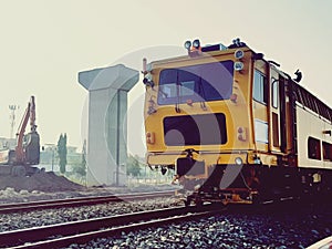 Repair train on the railway in modern train structure background