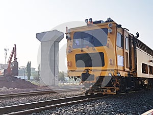 Repair train on the railway in modern train structure background