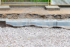 layers of tramroad and new curbs near sidewalk photo