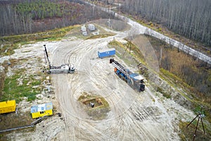 Repair work on the cluster site of oil wells. Geophysical studies in one of the wells. Shooting from a drone