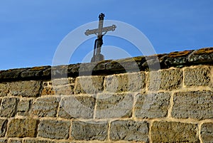Repaired renovated sandstone walls near the cemetery. stairs and railings of the wall made of new stone which weatheres quickly bu