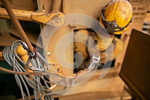Repairer working inside the confined space at mean time connecting back up safety rope with three two one pulleys system