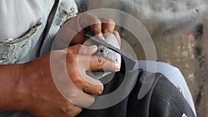 Repairing broken shoes by a shoe repairman