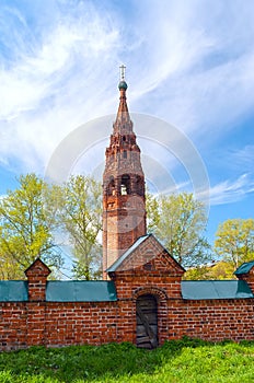 Repairing church of red brick in summer day