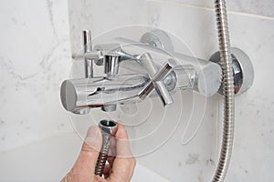 Repairing a faucet in a bathroom