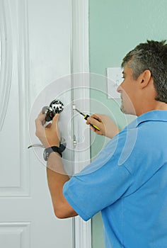 Repairing installing door deadbolt lock on house