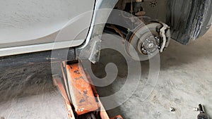 Repairing a leaky wheel using a jack