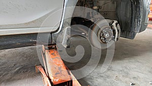 Repairing a leaky wheel using a jack