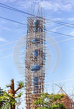 Repairing a mosque using Traditional bamboo scaffolding, Dembecha City, Amhara Region Ethiopia photo