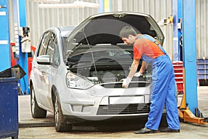 Repairman auto mechanic at work