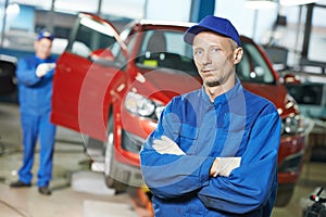 Repairman auto mechanic at workshop