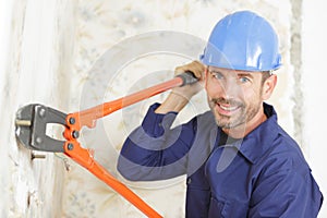 repairman builder holds pliers