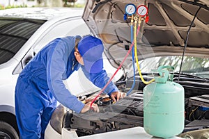 Repairman check and fixed car air conditioner system, Technician checked car air conditioning system refrigerant recharge, Air