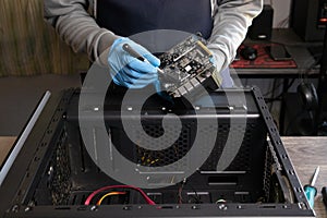 Repairman cleaning computer equipment.