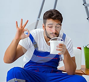 Repairman doing renovation repair in the house with paper wallpa