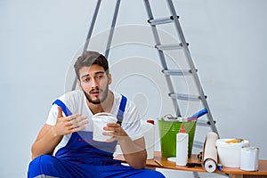 Repairman doing renovation repair in the house with paper wallpa