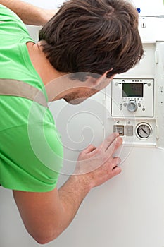 Repairman fixing a boiler