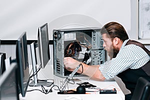 Repairman fixing components in computer unit