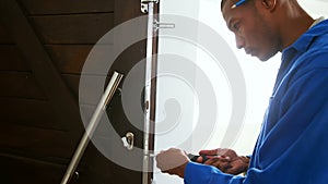 Repairman fixing cupboard