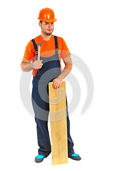 Repairman with hammer and wood plank