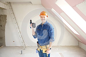 Repairman holding drill in his hand