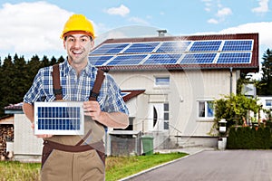 Repairman Holding Solar Panel