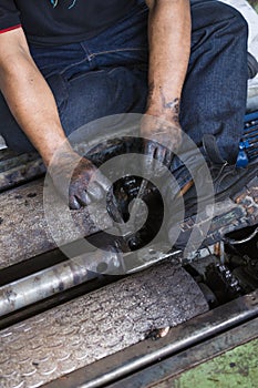 repairman holding a wrench and tighten and during maintenance work of machine