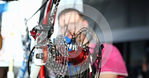 Repairman installing velocipede gear