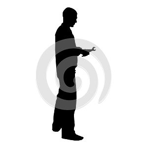 Repairman master man in overalls with tool in his hands nut key key spanner spanner wrench wrench icon black color vector