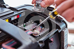 The repairman repairing broken color printer