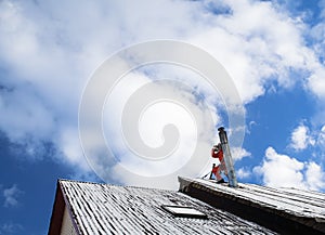 Repairman on a roof