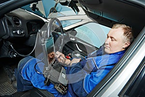 Repairman servicing auto car