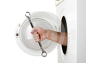 Repairman servicing washing machine