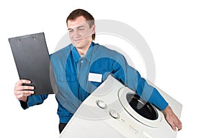 Repairman servicing washing machine