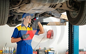 repairman and technician in car garage service in blue uniform