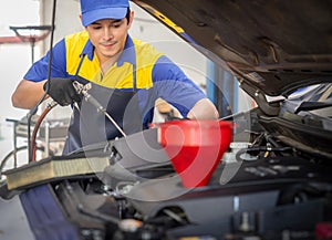 repairman and technician in car garage service in blue uniform