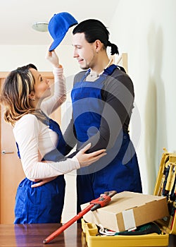 Repairman and woman having romance